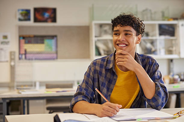 Student reviewing notes in a library